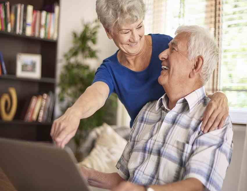 elder-looking-for-insurance-using-their-laptop-together