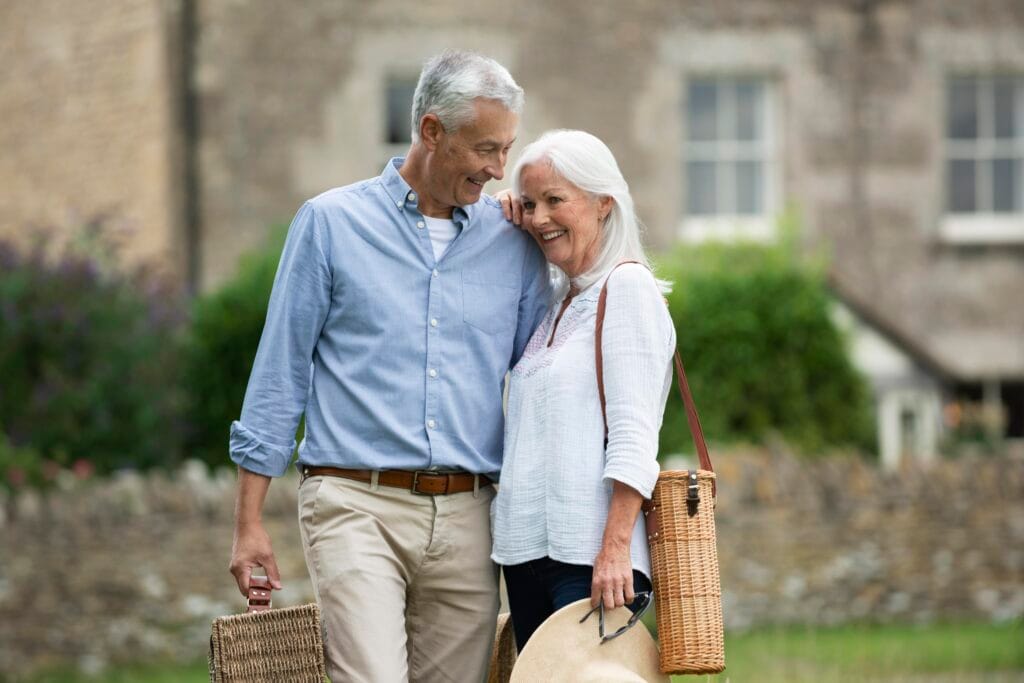 adorable-senior-couple-being-affectionate-while-taking-walk