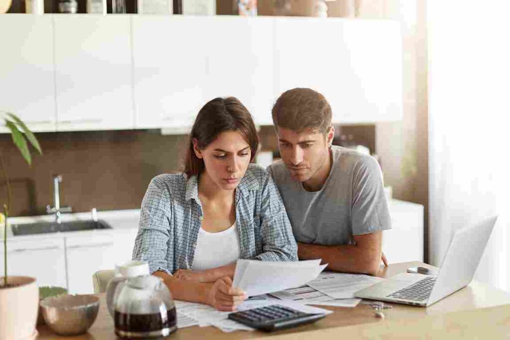 young-couple-checking-their-family-budget
